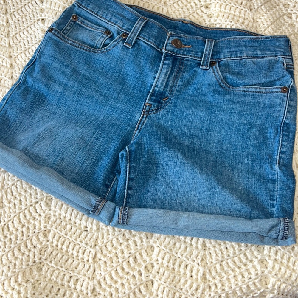 Levi’s jean women shorts size 25. Mid rise/mid length. Folded leg. GUC no damage